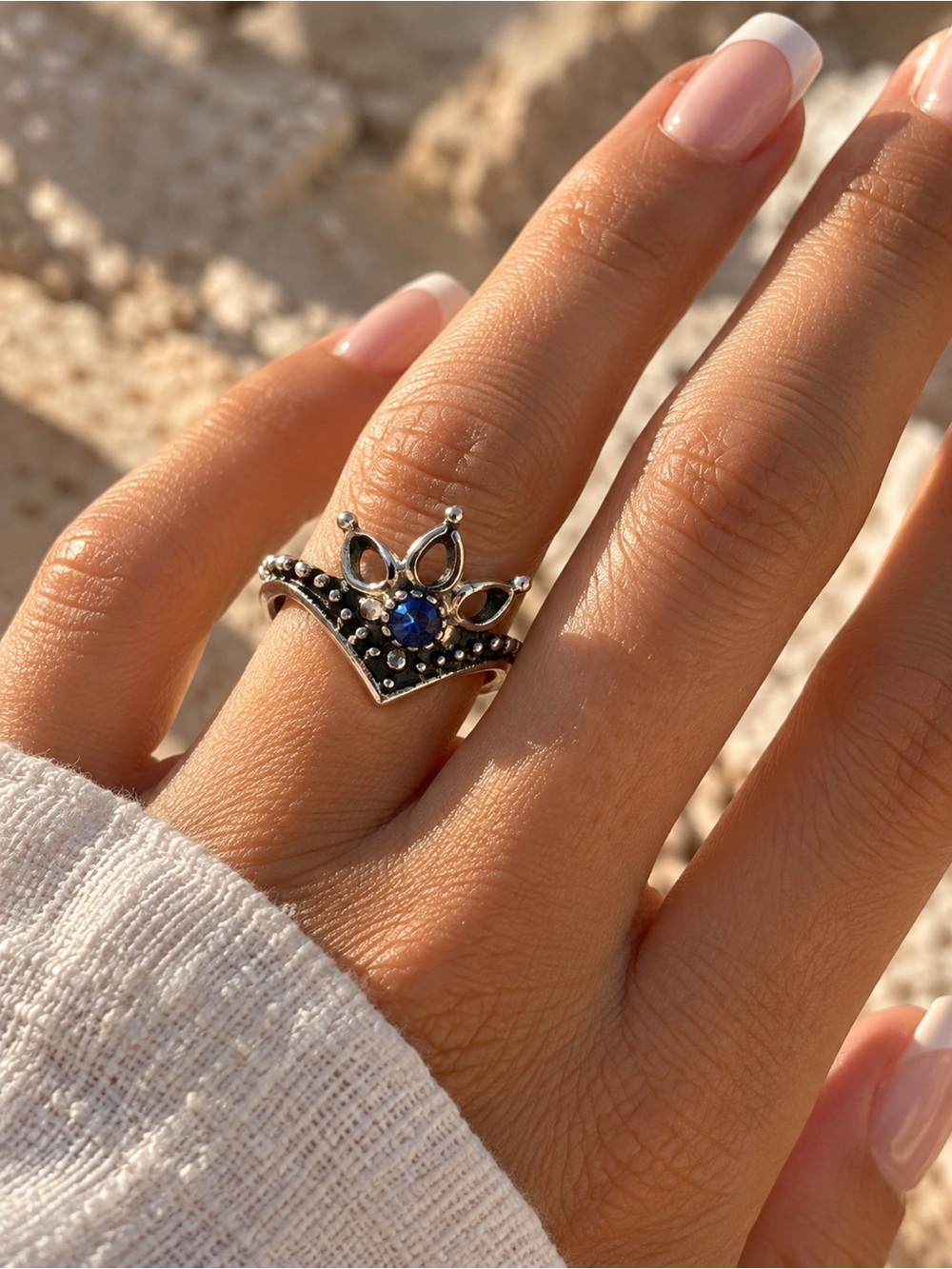 Silver tone Crown Ring with Blue Gem